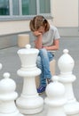 Little girl playing chess game. Royalty Free Stock Photo