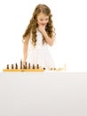 Little girl playing chess.Isolated on white background Royalty Free Stock Photo