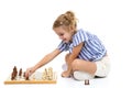 Little girl playing chess.On white background. Royalty Free Stock Photo