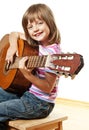 Little girl playing classical guitar