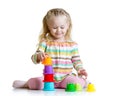 Little girl playing with color toys Royalty Free Stock Photo