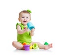 Little girl playing with color toys Royalty Free Stock Photo