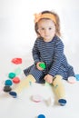 Little girl playing with colored plasticine isolated on the white background Royalty Free Stock Photo