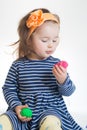 Little girl playing with colored plasticine isolated on the white background Royalty Free Stock Photo