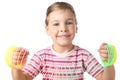 Little girl playing with colorful plastic spring