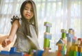 Little girl playing with construction toy blocks building a tower Royalty Free Stock Photo