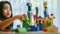 Little girl playing with construction toy blocks building a tower Royalty Free Stock Photo
