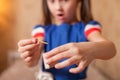 Little girl playing dangerous game with matches Royalty Free Stock Photo