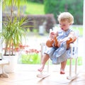 Little girl playing with doll Royalty Free Stock Photo