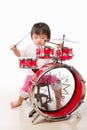 Little girl playing drum