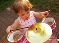 Little girl playing drums Royalty Free Stock Photo