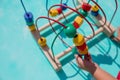 Little girl playing with educational toy - labyrinth. kindergarten concept, lifestyle. Early education and development