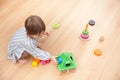 Little girl is playing with educational toys at home Royalty Free Stock Photo