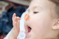 Little girl playing with elastic band on nouse Royalty Free Stock Photo