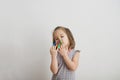 Little girl playing with felt tip pens stuff. baby girl painting and playing. colorful felt pen caps on fingers Royalty Free Stock Photo