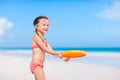 Little girl playing frisbee