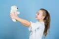 Little girl playing game in playroom. small girl with soft bear toy. child psychology playground in kindergarten. toy Royalty Free Stock Photo