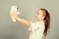 Little girl playing game in playroom. small girl with soft bear toy. child psychology playground in kindergarten. toy Royalty Free Stock Photo