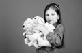Little girl playing game in playroom. toy shop. childrens day. Best friend. hugging a teddy bear. happy childhood Royalty Free Stock Photo
