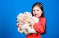 Little girl playing game in playroom. toy shop. childrens day. Best friend. hugging a teddy bear. happy childhood Royalty Free Stock Photo