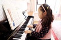 Little girl playing the piano at home Royalty Free Stock Photo