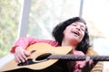 Little girl playing guitar Royalty Free Stock Photo