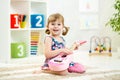 Little girl playing guitar Royalty Free Stock Photo