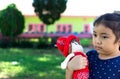 Little girl playing with her baby doll. Royalty Free Stock Photo