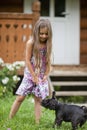 Little girl playing with her dog Royalty Free Stock Photo