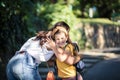 Little girl playing with her mother in nature Royalty Free Stock Photo