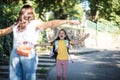 Little girl playing with her mother in nature Royalty Free Stock Photo