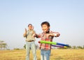 little girl playing with hula hoops outdoors Royalty Free Stock Photo