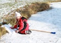 Little girl playing on iced pond Royalty Free Stock Photo