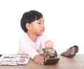 The little girl is playing an investment and financial management game Royalty Free Stock Photo