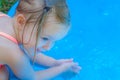 Little Girl Playing in a Kiddie Pool