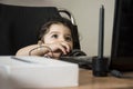 Little girl playing with laptop computer