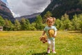 Little girl playing in nature and smiling