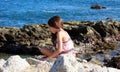 Little girl playing at ocean front in Los Cabos Mexico resort cliff sea Royalty Free Stock Photo