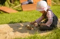 Little girl playing outdoor in sensory garden