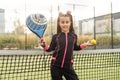 little Girl playing paddle tennis