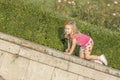 Little girl playing on parapet