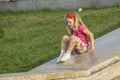 Little girl playing on parapet