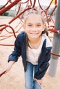 Little girl playing in the park in green background