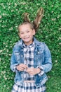 Little girl playing in the park in green background