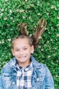 Little girl playing in the park in green background