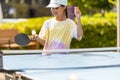 Little girl playing ping pong in park. Royalty Free Stock Photo