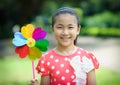 Little girl playing pinwheel Royalty Free Stock Photo