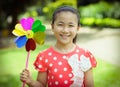 Little girl playing pinwheel Royalty Free Stock Photo