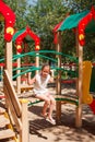 Little girl is playing at playground Royalty Free Stock Photo