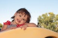 Little Girl Playing on Playground Equipment